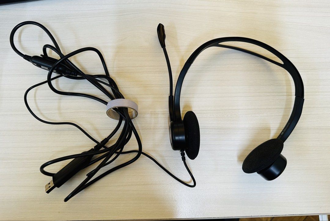 Logitech USB Headset with Mic (Category: Headphones & Headsets) located in Santa Rosa. Submitted by remini88 (Listing ID 1468974367, Image 1). Description: - Brand: Logitech Wired Headset - Color/Material: Sleek black with comfortable foam ear cushions - Audio & Mic: Built-in microphone on a flexible boom arm - Controls: Handy inline volume and mute controls on the cable - Connectivity: USB connector plug (Plug & Play) - Best For: Work calls, onl