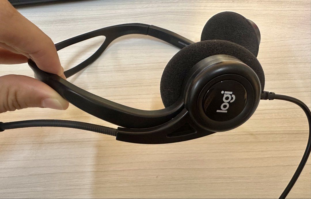 Logitech USB Headset with Mic (Category: Headphones & Headsets) located in Santa Rosa. Submitted by remini88 (Listing ID 1468974367, Image 2). Description: - Brand: Logitech Wired Headset - Color/Material: Sleek black with comfortable foam ear cushions - Audio & Mic: Built-in microphone on a flexible boom arm - Controls: Handy inline volume and mute controls on the cable - Connectivity: USB connector plug (Plug & Play) - Best For: Work calls, onl