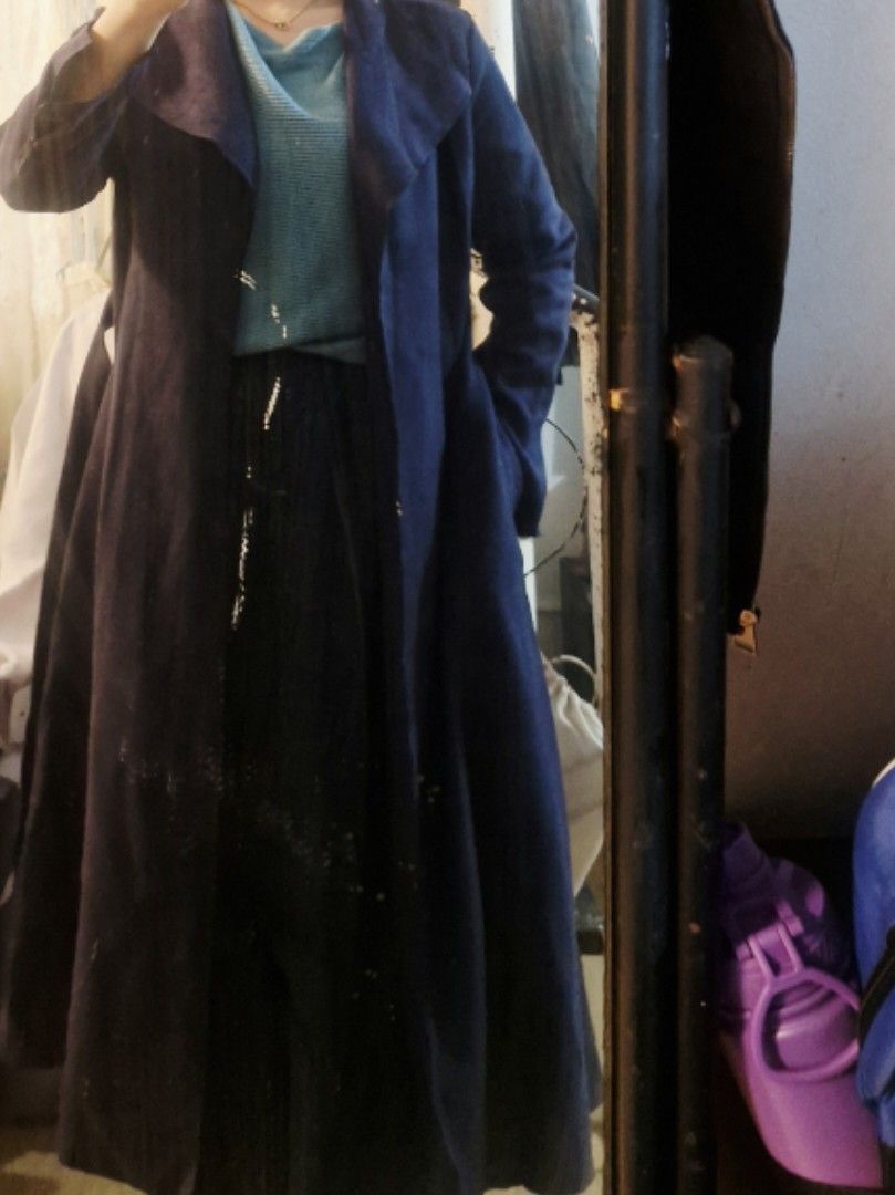 Long Blue Suede Trench Coat Jacket (Category: Coats, Jackets and Outerwear) located in Quezon City. Submitted by smrcloset (Listing ID 1469062355, Image 3). Description: - Material: Blue suede with layered black fabric underneath - Design: Open front with wide lapels and long sleeves - Length: Long, reaches past the knees - Features: Warm outer layer, perfect for cooler weather - Style: Easy to throw on over any outfit.