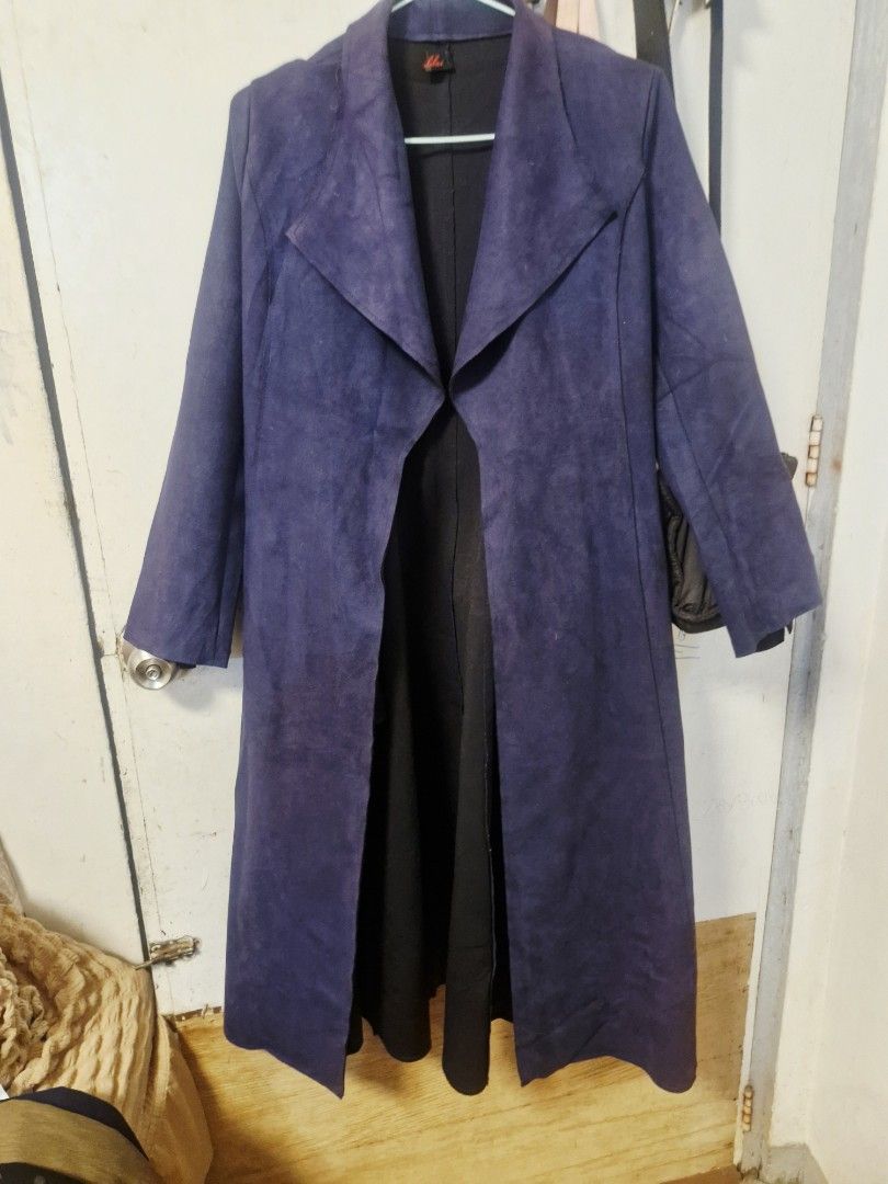 Long Blue Suede Trench Coat Jacket (Category: Coats, Jackets and Outerwear) located in Quezon City. Submitted by smrcloset (Listing ID 1469062355, Image 2). Description: - Material: Blue suede with layered black fabric underneath - Design: Open front with wide lapels and long sleeves - Length: Long, reaches past the knees - Features: Warm outer layer, perfect for cooler weather - Style: Easy to throw on over any outfit.
