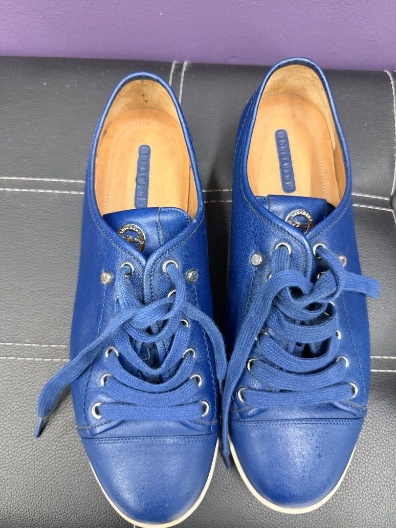 Longchamp Blue Leather Sneakers (Category: Sneakers) located in Quezon City. Submitted by ellamenopi (Listing ID 1468937821, Image 1). Description: - Brand: Longchamp - Color: Bright blue with tan leather lining - Closure: Lace-up with silver eyelets and branded metal tongue medallion - Condition: Uppers are clean with minimal creasing; white rubber outsoles show normal wear from previous use - Perfect casual statement sneakers for everyday wear 