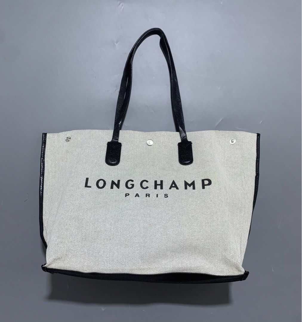 LONGCHAMP Canvas Tote Bag (Category: Tote Bags) located in Mabalacat. Submitted by thrift_trap (Listing ID 1469083265, Image 2). Description: Condition: Good Issue (s): Minimal lints, minimal yellow stain, need cleaning outside & inside, 1 button working pero hindi masyadong kapit (see pics) .