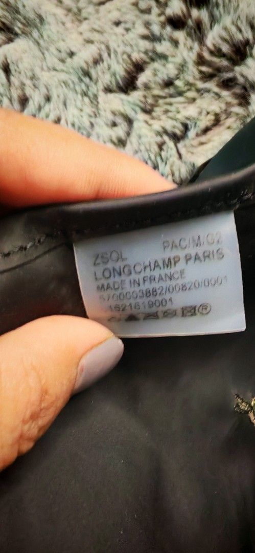 Longchamp Paris Tote Bag black (Category: Luxury Bags & Wallets) located in Caloocan City. Submitted by miyaka_lm (Listing ID 1469088526, Image 3). Description: - Authentic Longchamp tote bag in d - Medium size, ideal for daily use - Classic durable nylon body with leather flap closure and handles - Elegant gold-tone hardware and snap button - Signature embroidered jockey logo on the front - Interior tag shows model details and origin - Condition