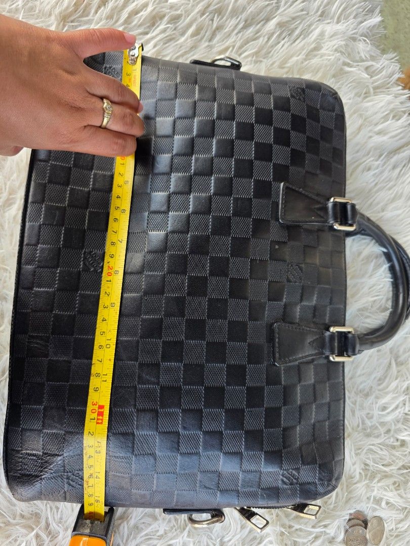 Louis Vuitton Damier Infini Briefcase Black (Category: Briefcases) located in Lemery. Submitted by venus23 (Listing ID 1469032138, Image 2). Description: - Brand: Louis Vuitton Paris (Made in France) - Material: Premium Black Damier Infini Leather - Hardware: Silver-tone with side D-rings (strap not included) - Closure: Secure all-around zip - Interior: Fabric lining featuring practical slip pockets and pen loops - Size: Approximately 15 inches a