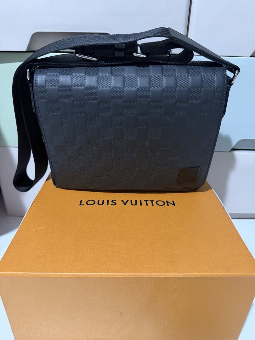 LV Messenger Bag (Category: Luxury Bags & Wallets) located in Quezon City. Submitted by khayedee (Listing ID 1469136837, Image 1). Description: - Authentic Louis Vuitton messenger bag - Premium black Damier Infini leather with embossed LV logo - Secure structured flap closure with clean side stitching - Practical back zipper pocket for quick access - Adjustable black fabric strap with sleek silver-tone hardware - Includes original orange box - Gu
