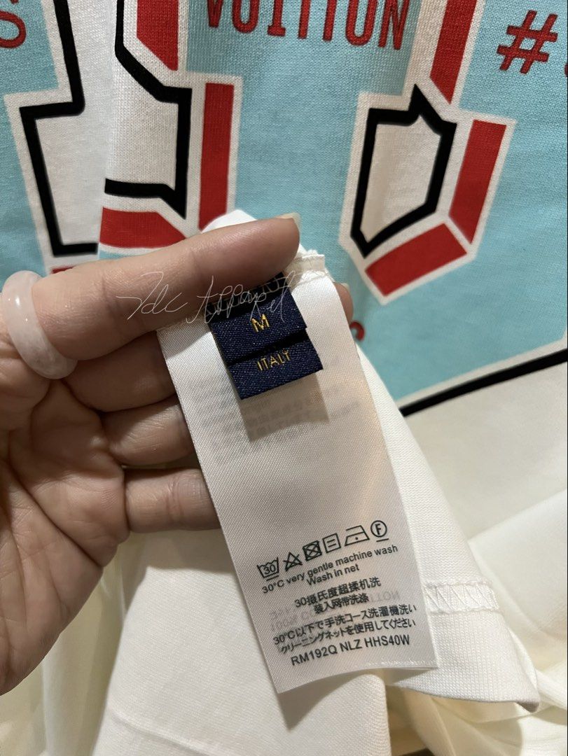 Louis Vuitton Graphic T-Shirt | White & Red (Category: Luxury Apparel) located in Imus. Submitted by vdc.apparel (Listing ID 1469111177, Image 3). Description: Almost new never used Louis Vuitton Graphic T-Shirt | White & Red.