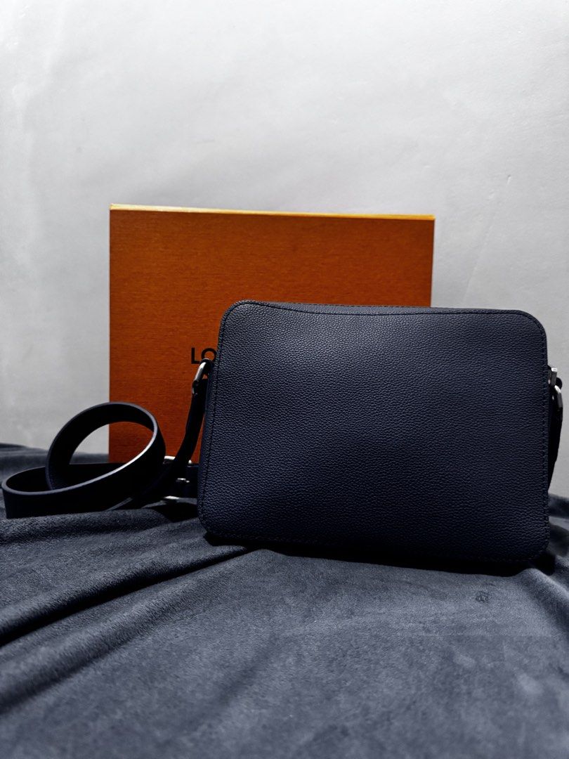 Louis Vuitton Messenger Bag (Category: Luxury Bags & Wallets) located in Caloocan City. Submitted by davidgenec64903 (Listing ID 1468979192, Image 2). Description: - Authentic Louis Vuitton dark blue textured leather messenger bag - Adjustable shoulder strap with sleek silver-tone hardware - Front flap pocket featuring debossed LV logo - Secure main zip compartment with clean fabric lining - Interior leather tag stamped Louis Vuitton Paris Made i