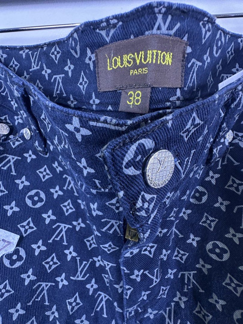 Louis Vuitton Monogram Damier Print Denim Jeans (Category: Jeans) located in Manila. Submitted by declutterpromax (Listing ID 1468969963, Image 2). Description: - Brand: Louis Vuitton - Color: Dark Blue - Size: 38 (marked on waistband) - Pattern: All-over monogram with contrast Damier checkerboard back pockets - Details: Branded button closure, zip fly, woven neck tag, and custom hardware.