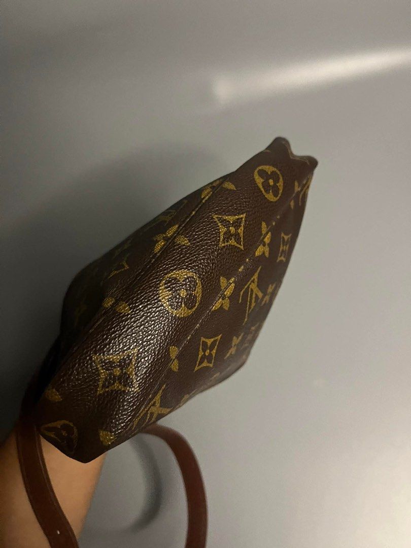 Louis Vuitton Monogram Pochette (Category: Luxury Bags & Wallets) located in Lipa City. Submitted by roan.sspree (Listing ID 1469068409, Image 2). Description: - Authentic Louis Vuitton monogram coated canvas pouch - Secure top zipper closure for daily essentials - Includes a detachable brown leather strap with gold-tone hardware - Compact size with a structured base.