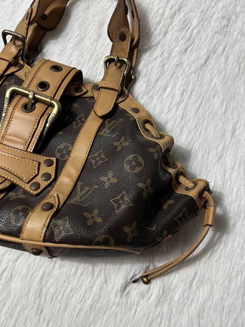 Louis Vuitton Monogram Theda PM Shoulder Bag (Category: Luxury Bags & Wallets) located in Quezon City. Submitted by commonwealthpickerph (Listing ID 1468982084, Image 3). Description: Louis Vuitton Monogram Theda PM Shoulder Bag - Features iconic monogram pattern with chic tan leather trim and gold-tone hardware - Practical buckle front closure and stylish drawstring sides - Comfortable double shoulder straps accented with contrast yellow stitchi