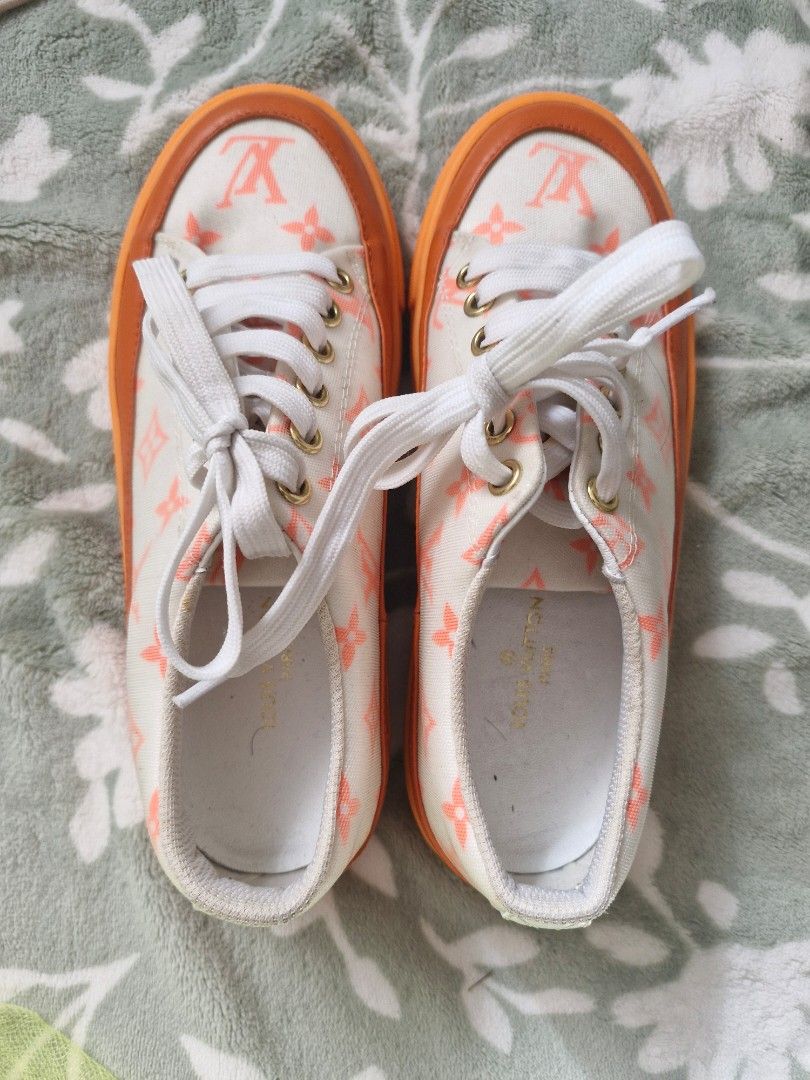 Louis Vuitton Orange Monogram Canvas Low Top Sneakers (Category: Sneakers) located in Angeles City. Submitted by mycloset525clotheshoppe (Listing ID 1468931265, Image 1). Description: - Brand: Louis Vuitton - Style: Casual low-top sneakers - Color: White and Orange with all-over monogram pattern - Details: Orange rubber mudguard, white laces with gold eyelets - Interior: White lining with Louis Vuitton Paris gold stamp on the insole - Condition: 