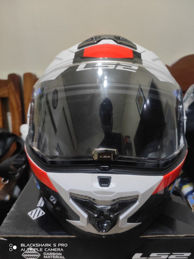 LS2 Advant II Modular Helmet Carbon White Red Blue (Category: Motorbikes for Sale) located in Mandaluyong City. Submitted by human_crates (Listing ID 1469094721, Image 1). Description: LS2 Advant II modular helmet in white, red, blue, and black carbon pattern. Size XXL. Includes original box and clear visor. Flip-up chin bar mechanism works smoothly. Interior padding clean and intact. High-end touring helmet ready for the road..