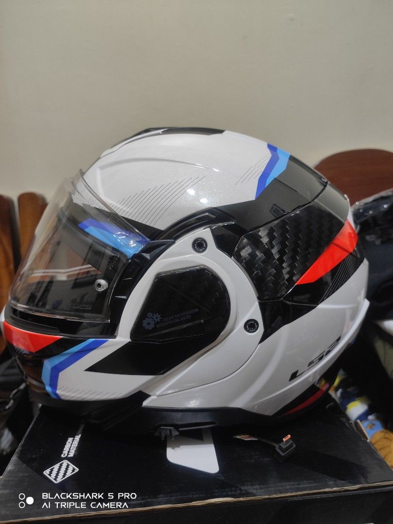 LS2 Advant II Modular Helmet Carbon White Red Blue (Category: Motorbikes for Sale) located in Mandaluyong City. Submitted by human_crates (Listing ID 1469094721, Image 2). Description: LS2 Advant II modular helmet in white, red, blue, and black carbon pattern. Size XXL. Includes original box and clear visor. Flip-up chin bar mechanism works smoothly. Interior padding clean and intact. High-end touring helmet ready for the road..