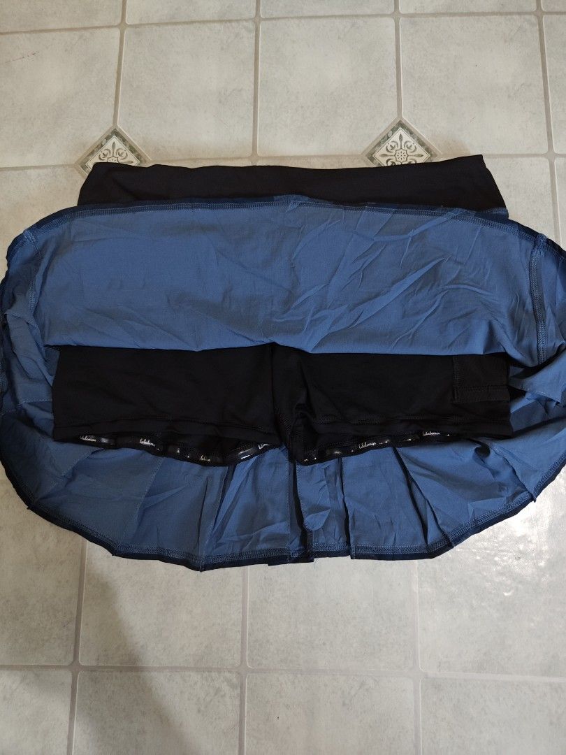 Lululemon (Category: Skirts) located in Mandaue City. Submitted by prekfinds (Listing ID 1468992520, Image 3). Description: Lululemon Heathered Texture Lotus Camo Oil Slick Blue / Black colorway Pace Setter Skirt 4-way Stretch, tiered pleated athletic skort with built-in shorts and a rear zipper pocket As new condition Dot 8 Dimes:30-33W x 13L No issue.
