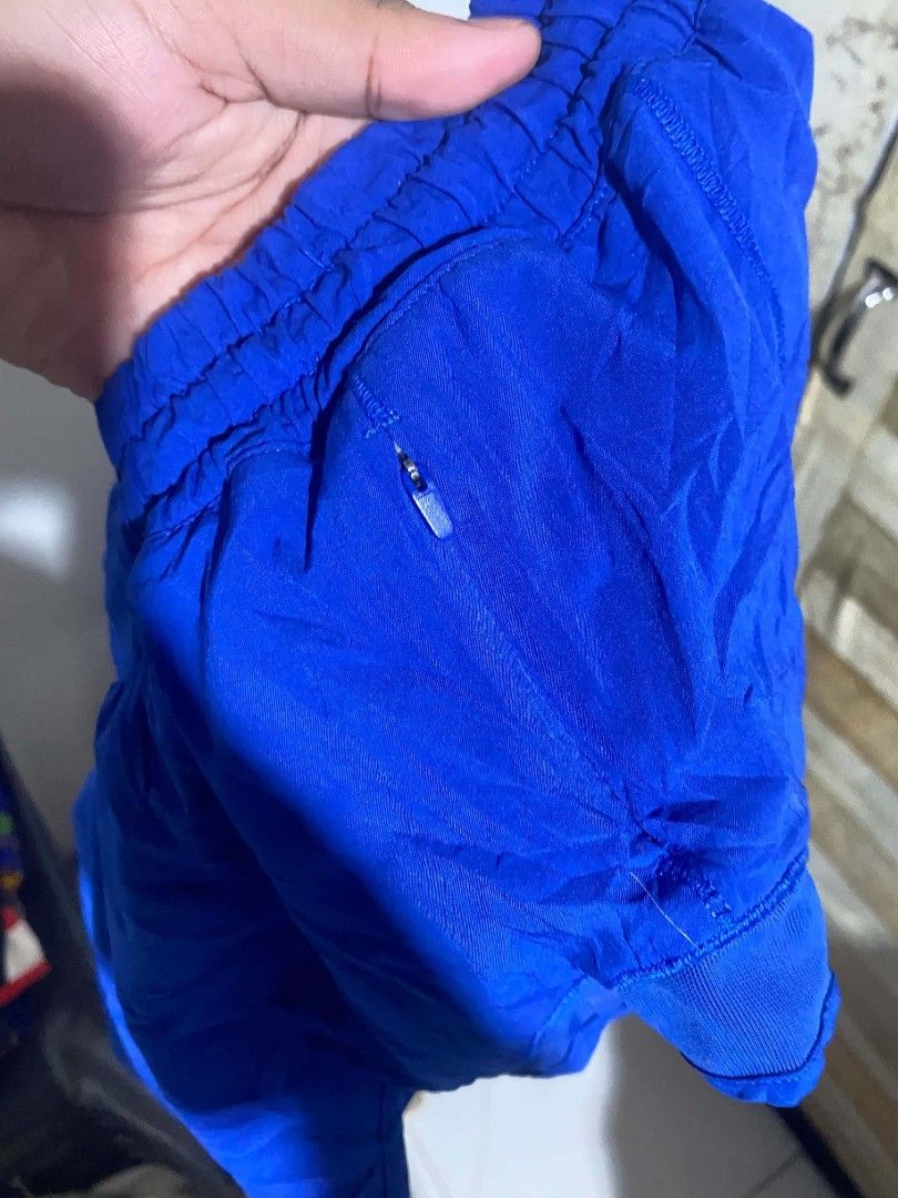 Lululemon Athletic Running Shorts Blue DOT 4 (Category: Shorts) located in Maasin. Submitted by trippythirftyyy (Listing ID 1469103993, Image 3). Description: - Brand: Lululemon - Color: Bright blue -Dot 4 (small) - Ideal for: Running, workouts, and gym sessions - Fit: Comfortable elastic waistband - Storage: Convenient small zippered pocket on the back - Safety: Reflective logo detail near the hem - Material: Lightweight and breathable fabric.