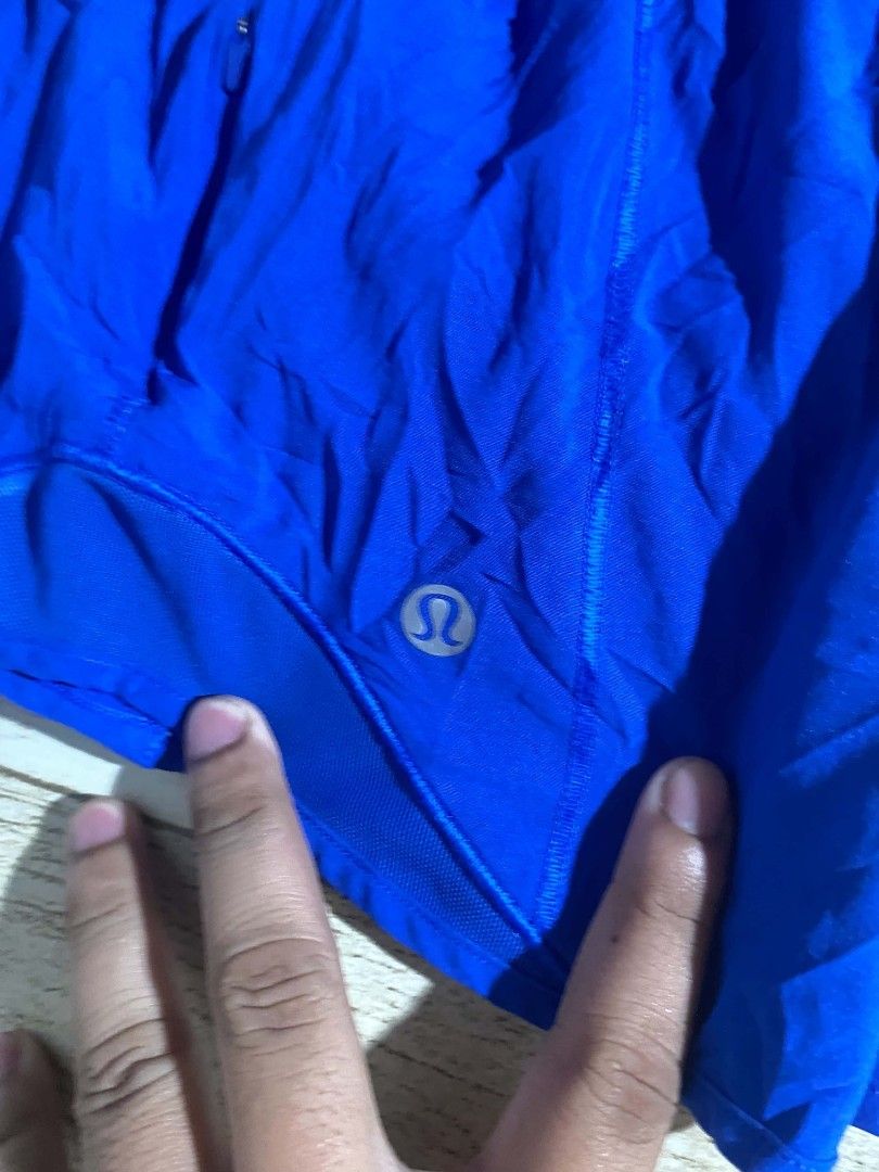 Lululemon Athletic Running Shorts Blue DOT 4 (Category: Shorts) located in Maasin. Submitted by trippythirftyyy (Listing ID 1469103993, Image 2). Description: - Brand: Lululemon - Color: Bright blue -Dot 4 (small) - Ideal for: Running, workouts, and gym sessions - Fit: Comfortable elastic waistband - Storage: Convenient small zippered pocket on the back - Safety: Reflective logo detail near the hem - Material: Lightweight and breathable fabric.