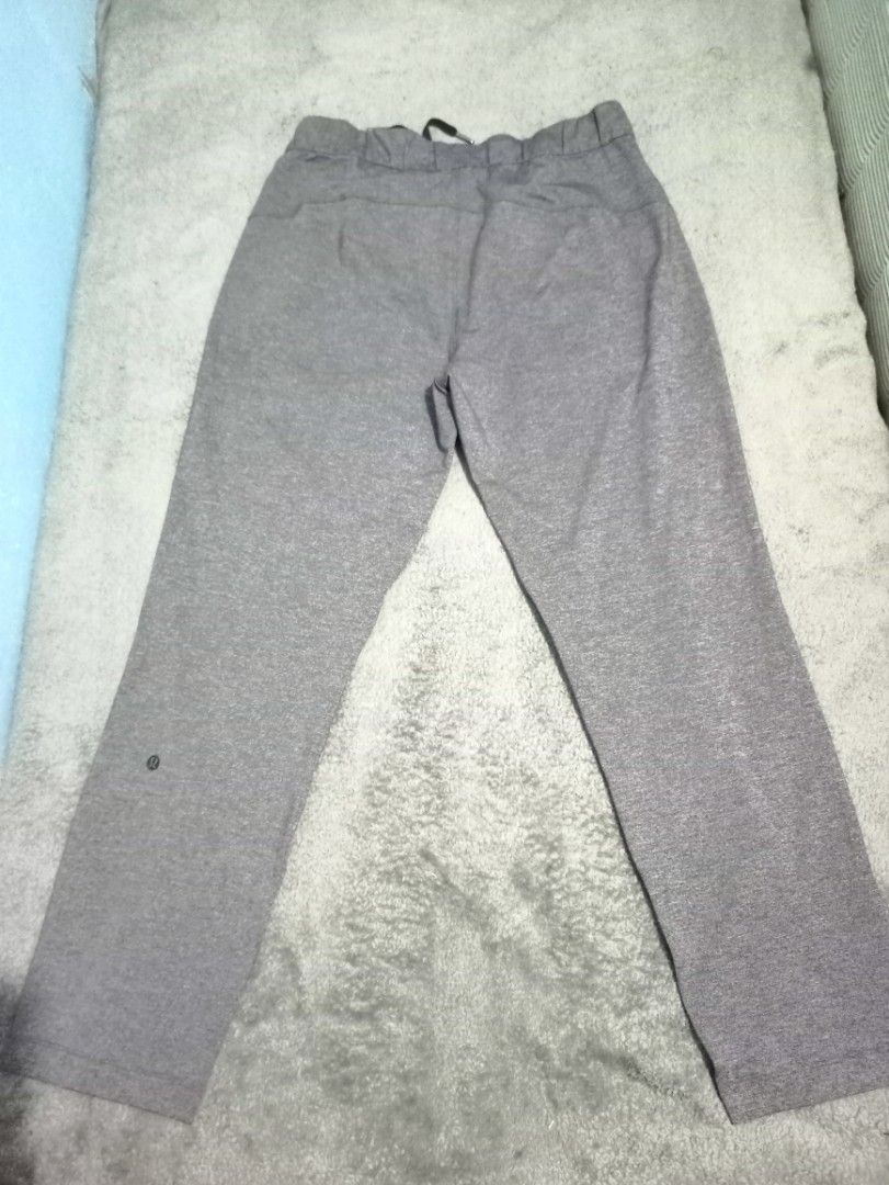 Lululemon Dot On The Fly Pants Grey Size 8 (Category: Jeans) located in Manila. Submitted by thecomftrift.co (Listing ID 1468979486, Image 3). Description: - Brand: Lululemon - Style: Dot On The Fly Pants - Color: Grey - Size: 8 - Waist: 31 inches (stretches up to 40 inches) - Length: 38 inches - Details: Elastic waistband with adjustable drawstring, side pockets, and signature logo near the lower leg - Condition: Great everyday athleisure wear w