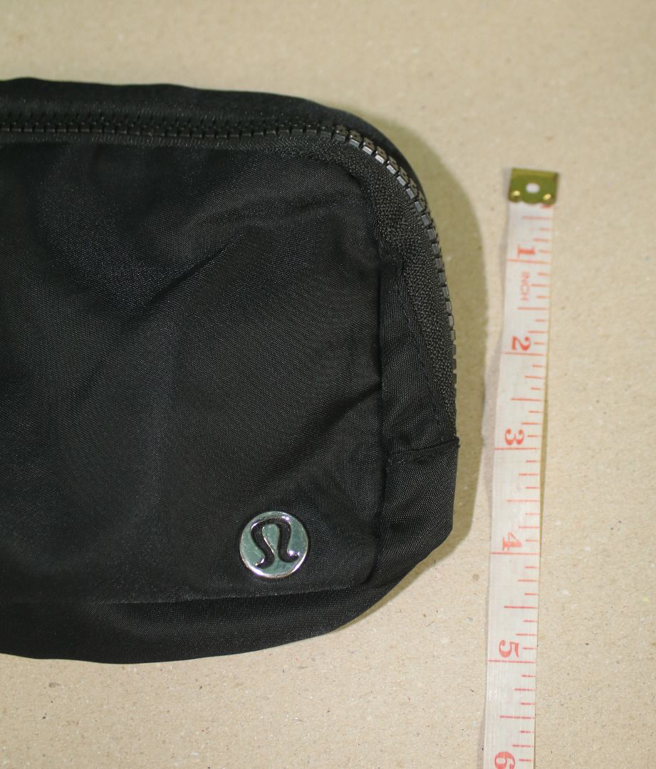 Lululemon Everywhere Belt Bag (Category: Beach Bags) located in Cebu City. Submitted by sinina.station (Listing ID 1468977504, Image 3). Description:  1L Standard Size)  Black with a silver/chrome logo  Water-repellent nylon body with a polyester liner  Includes an exterior zippered security pocket on the back, internal mesh slip compartments, and an adjustable strap with elastic loops Pre-owned. .