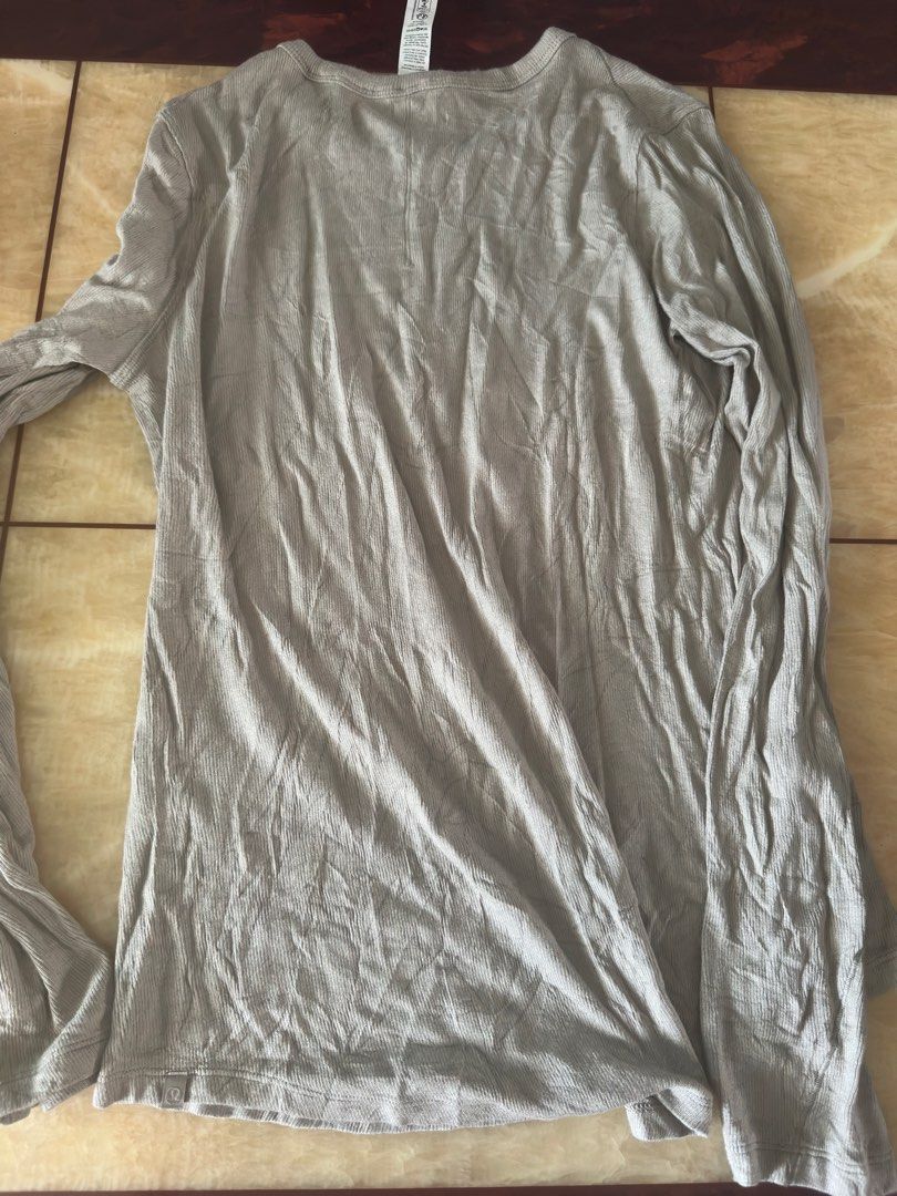 Lululemon Long Sleeve Ribbed Top Size 10 Grey (Category: Longsleeves) located in Manila. Submitted by jessj30 (Listing ID 1468958537, Image 3). Description: - Brand: Lululemon - Item: Ribbed Long Sleeve Top - Color: Grey - Size: 10 (Tag attached) - Material: 94% Lenzing Modal, 6% Elastane - Features: Crew neckline, long sleeves, signature subtle logo tab near hem - Origin: Made in Vietnam - Condition: Brand new with tag.