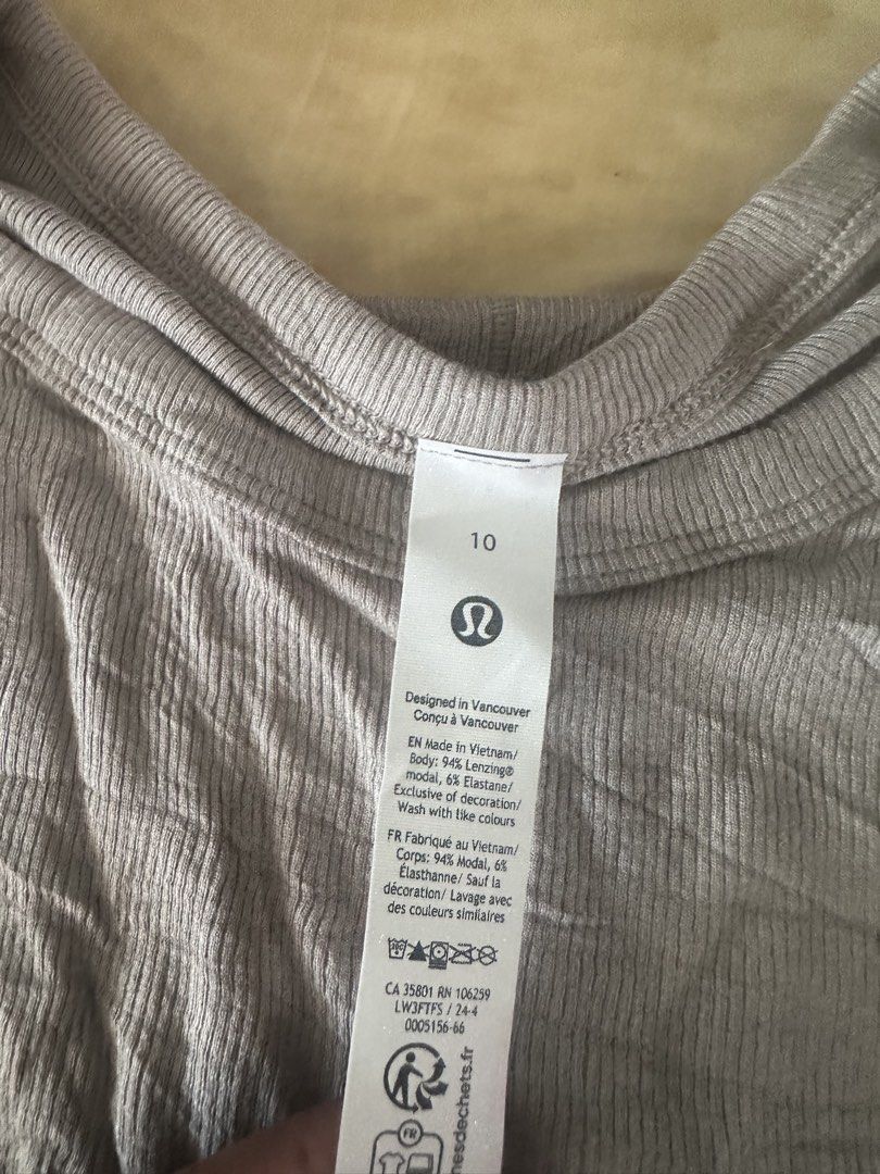 Lululemon Long Sleeve Ribbed Top Size 10 Grey (Category: Longsleeves) located in Manila. Submitted by jessj30 (Listing ID 1468958537, Image 2). Description: - Brand: Lululemon - Item: Ribbed Long Sleeve Top - Color: Grey - Size: 10 (Tag attached) - Material: 94% Lenzing Modal, 6% Elastane - Features: Crew neckline, long sleeves, signature subtle logo tab near hem - Origin: Made in Vietnam - Condition: Brand new with tag.