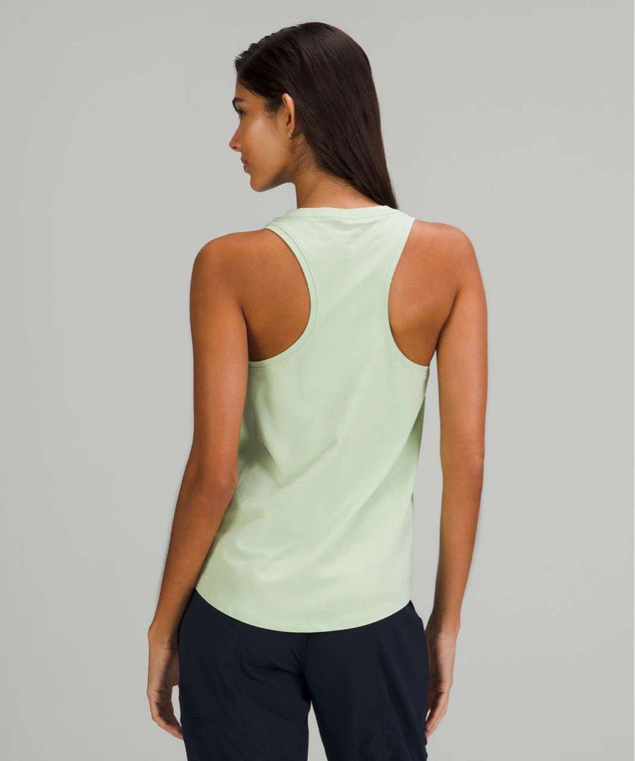Lululemon Love Tank Top Light Green - Dot 6 (Category: Sleeveless) located in Pagsanjan. Submitted by zhairaaaaa (Listing ID 1469111901, Image 3). Description: - Brand: Lululemon - Style: Racerback tank top with scoop neck and curved hem - Color: Light green - Size: 6 (tag attached) - Material: 94% Pima cotton, 6% Lycra spandex for stretch and comfort - Origin: Made in Peru - Details: Signature Lululemon logo stamped on upper back Verygood condit