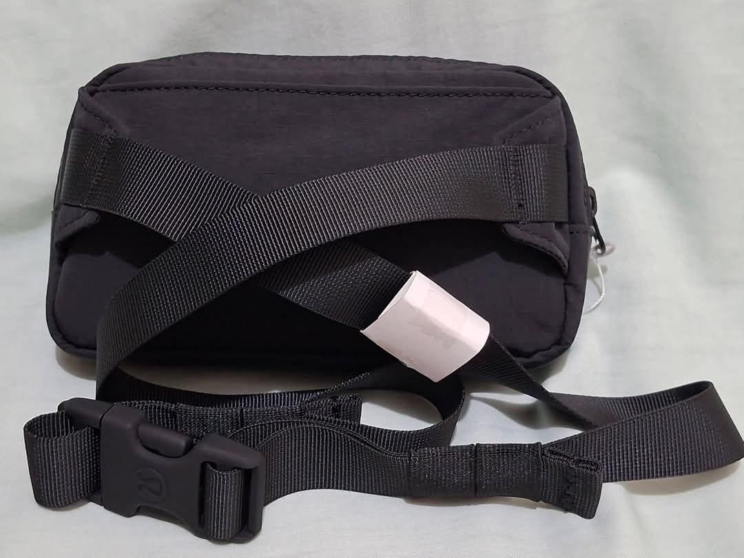Lululemon Mini Belt Bag Black (Category: Belt bags, Clutches and Pouches) located in Manila. Submitted by closetprincess (Listing ID 1468959056, Image 2). Description: - 100% Authentic Lululemon mini belt bag in classic black - Compact size: 19cm x 10.5cm, perfect for daily essentials - Durable ripstop nylon material built to last - Features an interior mesh pocket and iconic Lululemon logo patch - Adjustable strap with secure plastic buckle clos