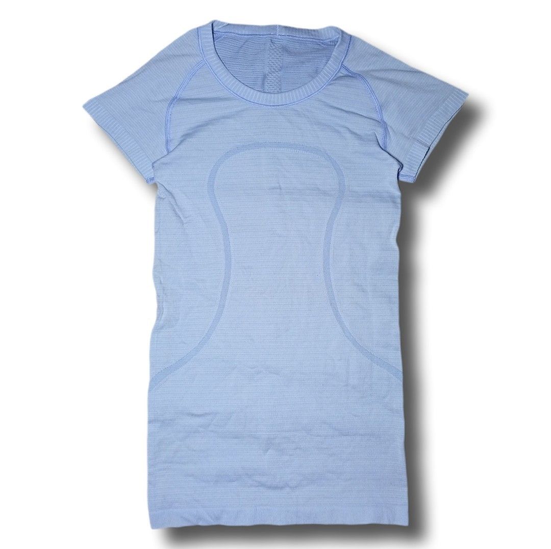 Lululemon Swiftly Tech Short Sleeve Crew Light Blue (Category: Activewear) located in Davao. Submitted by tj-289a (Listing ID 1468990316, Image 1). Description: - Brand: Lululemon - Color: Light blue - Style: Short sleeve, seamless ribbed knit with classic curve lines - Details: Iconic silver omega logo near the lower hem - Material: Breathable fabric, ideal for gym workouts or running - Condition: Excellent, kept in clean closet storage.