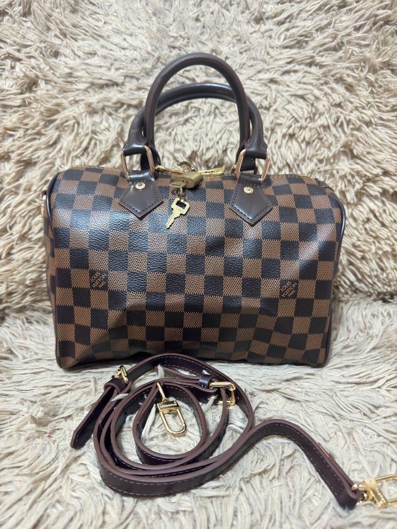 Lv bandolier Damier (Category: Luxury Bags & Wallets) located in Manila. Submitted by vilmabrandedukaybags (Listing ID 1469076581, Image 1). Description: L V SPEEDY BANDOULIER DOCTOR’S BAG Damier Ebene Canvas Small size or 25cm With Padlock and Sling Strap Pm🤗.