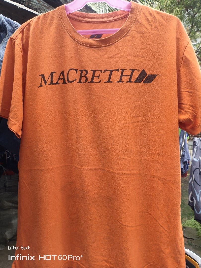 Macbeth T-Shirt Orange (Good Condition) (Category: Tshirts & Polo Shirts ) located in Las Pinas. Submitted by brightfox-fa27 (Listing ID 1469062406, Image 1). Description: Brand: Macbeth Footwear & Apparel Color: Vibrant Orange Design: Classic black Macbeth wordmark print across the chest Material: 100% Cotton (Soft, breathable, and very comfortable to wear) 8/10 Good Used Condition (GUC) - Shows minimal signs of wear but has no major flaws. Colo