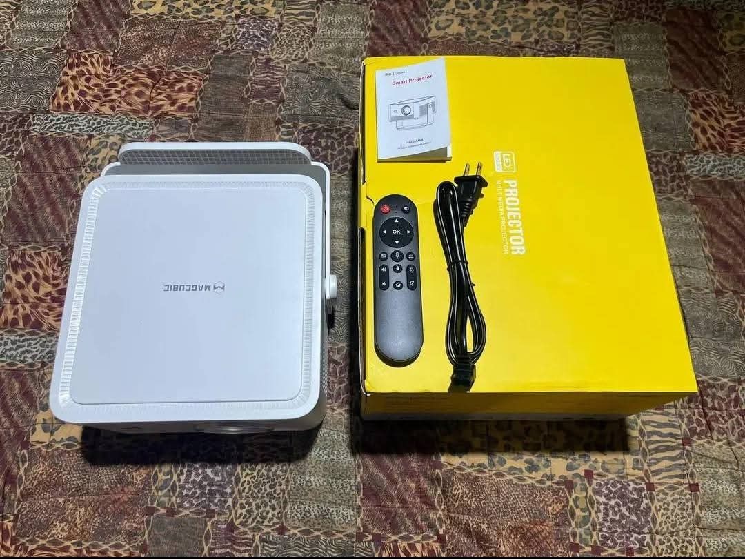 MAGCUBIC HY450MAX (Category: Projectors) located in Quezon City. Submitted by jcrafty.co (Listing ID 1469084989, Image 1). Description: FOR SALE MAGCUBIC HY450MAX PROJECTOR BRANDNEW✅ 7000 ONLY Key Specifications Resolution: Native 1080p Full HD with support for up to 4K and 8K video decoding. Brightness: 1100 ANSI Lumens, providing better visibility under ambient light compared to older models. Contrast Ratio: 2000:1 with HDR10 support. Hardware: