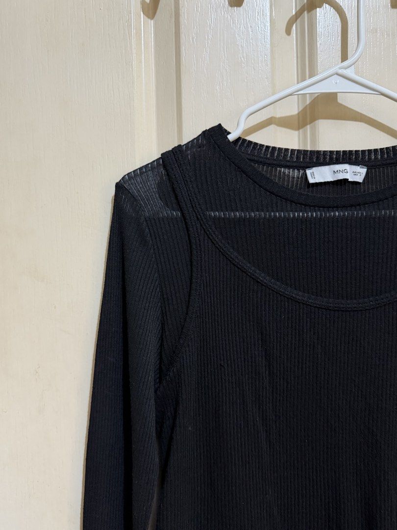 MANGO 90s Trend Black Ruffled Top (Category: Longsleeves) located in Pasig City. Submitted by paolasoriano_wind (Listing ID 1468958375, Image 2). Description: Lightly used. Excellent condition. No flaws. One piece (sewn-in). Semi sheer but wearing a simple black bra or tube top underneath will do. .