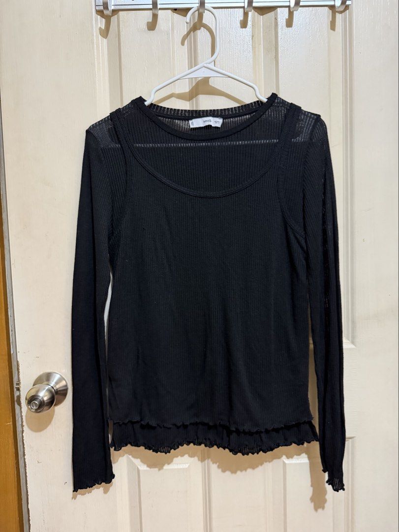 MANGO 90s Trend Black Ruffled Top (Category: Longsleeves) located in Pasig City. Submitted by paolasoriano_wind (Listing ID 1468958375, Image 1). Description: Lightly used. Excellent condition. No flaws. One piece (sewn-in). Semi sheer but wearing a simple black bra or tube top underneath will do. .