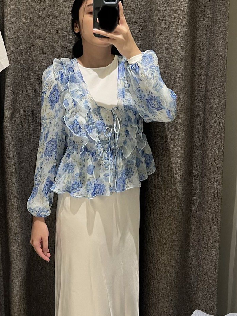 Mango Blue Floral Ruffle Blouse Top (Category: Blouses) located in Muntinlupa City. Submitted by yynsa (Listing ID 1469091657, Image 1). Description: Bought last year Blue floral ruffle blouse with tie front.