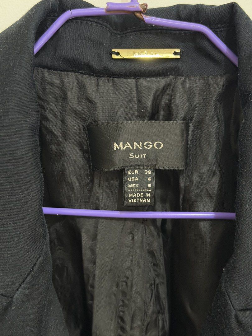 Mango Suit Black Blazer (Category: Coats, Jackets and Outerwear) located in Malolos. Submitted by eadiana (Listing ID 1468969968, Image 2). Description: - Brand: Mango Suit - Color: Black - Size: EUR 38 / USA 6 / MEX 5 - Condition: Excellent / Like New - Material: Fully lined inside - Features: Single button closure, front flap pockets, and a chest welt pocket - Origin: Made in Vietnam - Style: Classic tailored cut, ideal for office wear, intervi