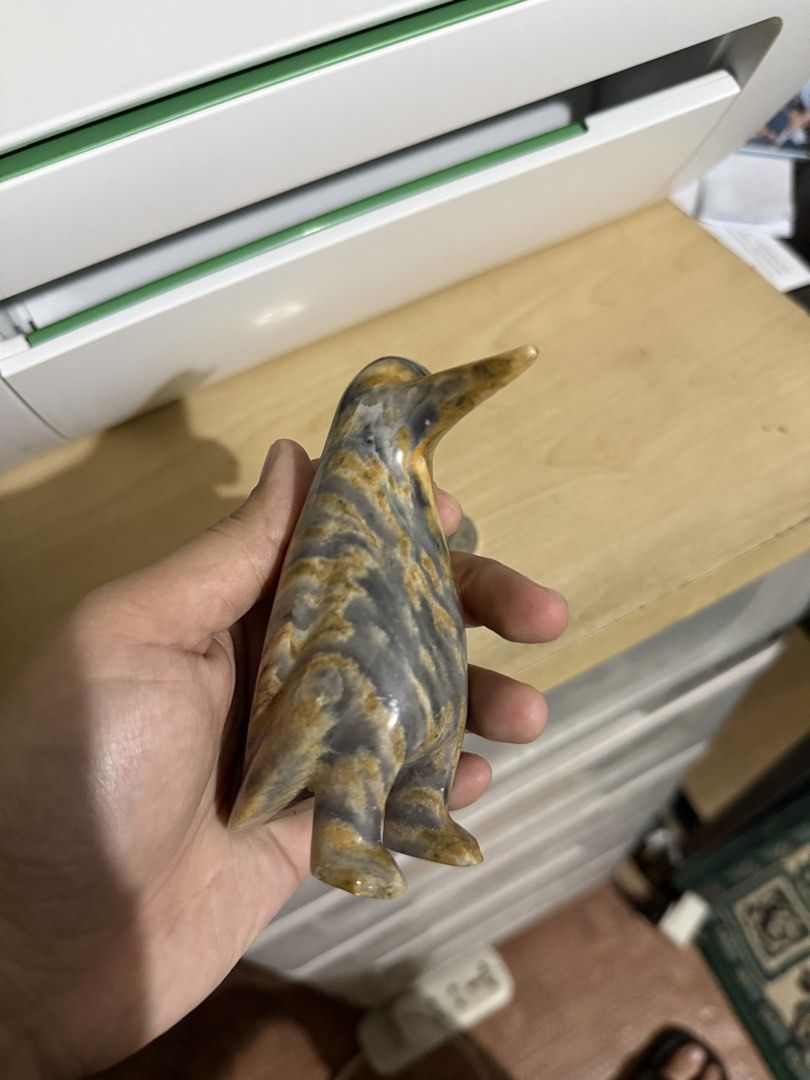 Marble\Hand carved stone penguin (Category: Figurines & Statues) located in Quezon City. Submitted by ae.thina (Listing ID 1469017778, Image 3). Description: - Hand-carved stone penguin figurine - Unique natural grey and brown banding patterns - Smooth, polished finish all over - Compact size fits comfortably in the palm of your hand - Perfect display piece for desks, shelves, or collection cabinets.