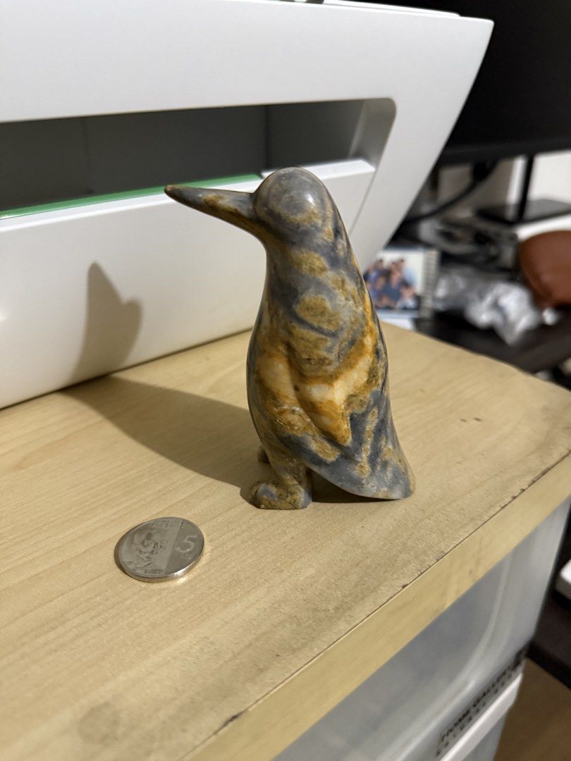 Marble\Hand carved stone penguin (Category: Figurines & Statues) located in Quezon City. Submitted by ae.thina (Listing ID 1469017778, Image 2). Description: - Hand-carved stone penguin figurine - Unique natural grey and brown banding patterns - Smooth, polished finish all over - Compact size fits comfortably in the palm of your hand - Perfect display piece for desks, shelves, or collection cabinets.