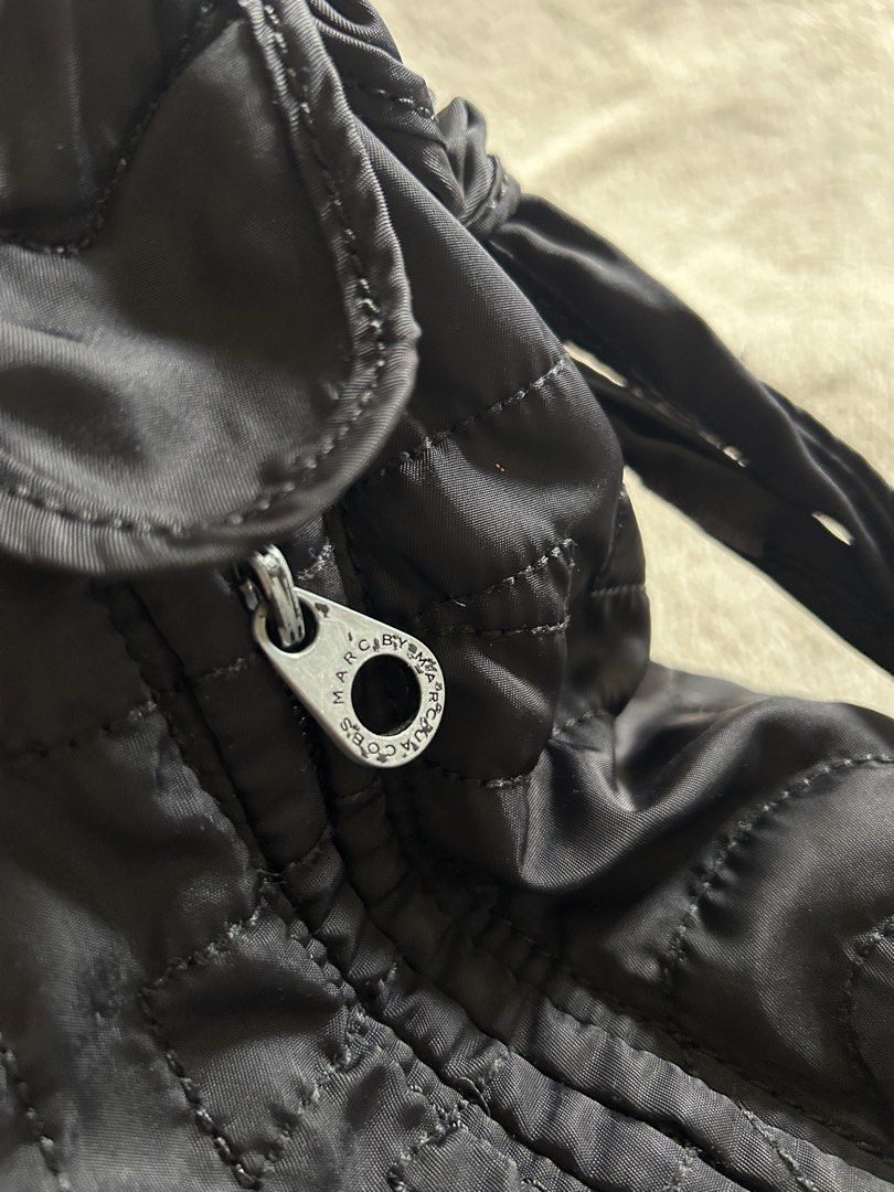 Marc by Marc Jacobs Nylon Hobo Bag (Category: Shoulder Bags) located in Carigara. Submitted by abiesclutter (Listing ID 1468962551, Image 3). Description: * Authentic-style classic black nylon hobo design with signature logo details * Condition: Good pre-loved condition with minor signs of usage * Handle: Some loose threads, but still manageable (see last picture) * Clean & Fresh: Washed and disinfected, ready for its next owner! * Lightweight, c