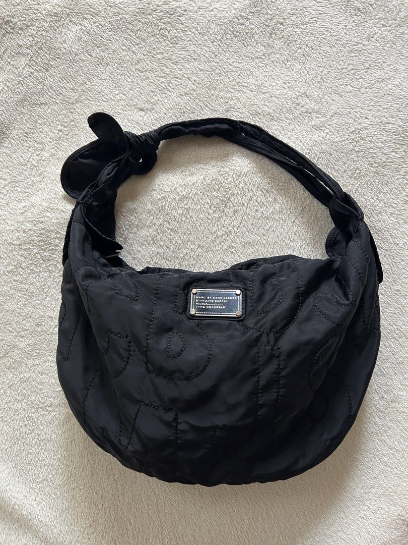 Marc by Marc Jacobs Nylon Hobo Bag (Category: Shoulder Bags) located in Carigara. Submitted by abiesclutter (Listing ID 1468962551, Image 1). Description: * Authentic-style classic black nylon hobo design with signature logo details * Condition: Good pre-loved condition with minor signs of usage * Handle: Some loose threads, but still manageable (see last picture) * Clean & Fresh: Washed and disinfected, ready for its next owner! * Lightweight, c