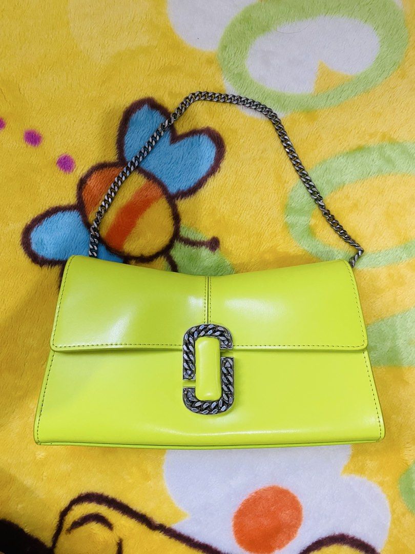 Marc Jacobs Neon Yellow J Marc Shoulder Bag (Category: Luxury Bags & Wallets) located in San Jose del Monte. Submitted by cityhanter007 (Listing ID 1469050758, Image 1). Description: - Brand: Marc Jacobs - Material: Premium leather in a vibrant neon green - Hardware: Sleek silver details - Closure: Bold chunky chain link on the front flap - Strap: Includes a stylish metallic chain strap - Design: Structured shape with clean, minimalist sides - Co