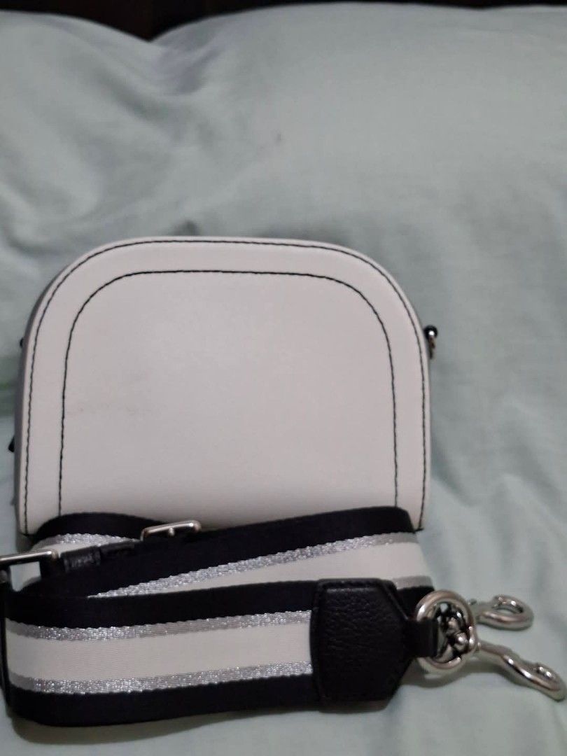 Marc Jacobs The Snapshot Camera Bag White Black (Category: Luxury Bags & Wallets) located in Manila. Submitted by closetprincess (Listing ID 1468958758, Image 2). Description: - Authentic Marc Jacobs camera bag in pristine white and grey leather - Stylish black and white striped web strap with silver accents (detachable and adjustable) - Secure dual zip closure with grey side panels - Features an internal slip pocket with brand label tag and fron