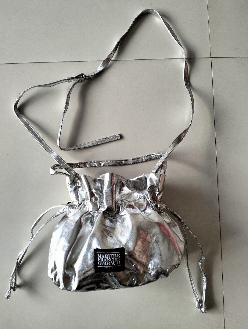 Marithé + François Girbaud (Category: Cross-body Bags) located in San Carlos City. Submitted by guioverlua72920 (Listing ID 1468958879, Image 1). Description: Marithé + François Girbaud Silver Bokjori / Drawstring Crossbody Bag Excellent condition Issue-sign of use ₱550+sf location San Carlos city Negros Occidental.