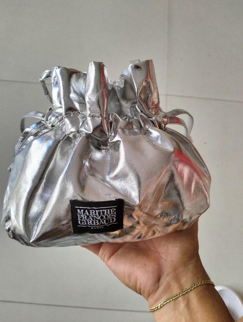 Marithé + François Girbaud (Category: Cross-body Bags) located in San Carlos City. Submitted by guioverlua72920 (Listing ID 1468958879, Image 3). Description: Marithé + François Girbaud Silver Bokjori / Drawstring Crossbody Bag Excellent condition Issue-sign of use ₱550+sf location San Carlos city Negros Occidental.