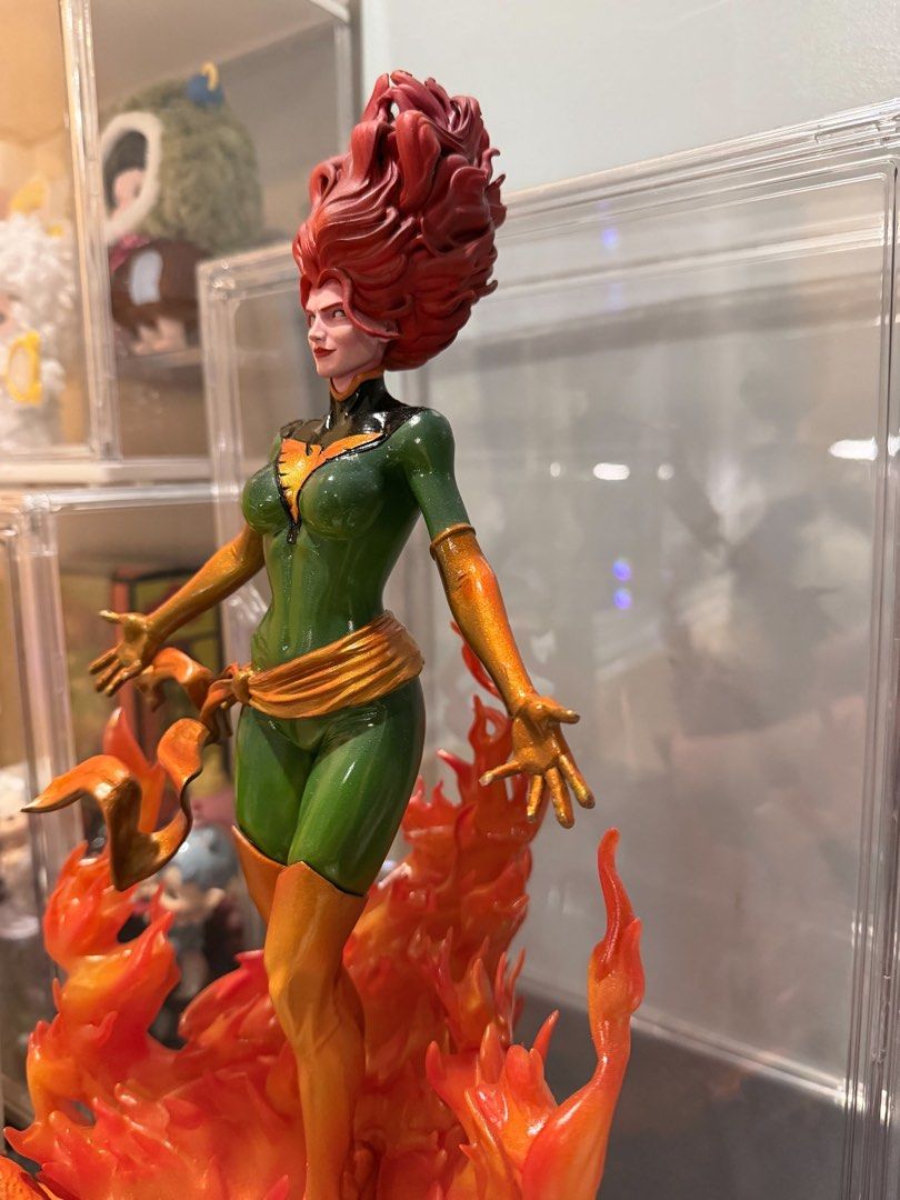 Marvel Jean Grey Phoenix Statue Figure (Category: Figurines & Statues) located in Piddig. Submitted by bennny_688 (Listing ID 1469040933, Image 2). Description: -Custom high end 3d resin print - 10 inches tall - Stunning green and gold Phoenix costume figure - Detailed red hair styling and expressive facial expression - Intricate translucent orange and red sculpted flame base - Figure stands upright securely on the fiery base - Flawless paintwork