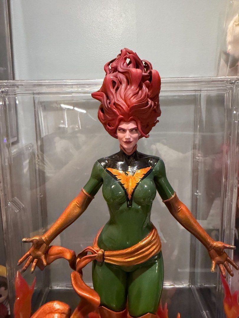 Marvel Jean Grey Phoenix Statue Figure (Category: Figurines & Statues) located in Piddig. Submitted by bennny_688 (Listing ID 1469040933, Image 3). Description: -Custom high end 3d resin print - 10 inches tall - Stunning green and gold Phoenix costume figure - Detailed red hair styling and expressive facial expression - Intricate translucent orange and red sculpted flame base - Figure stands upright securely on the fiery base - Flawless paintwork