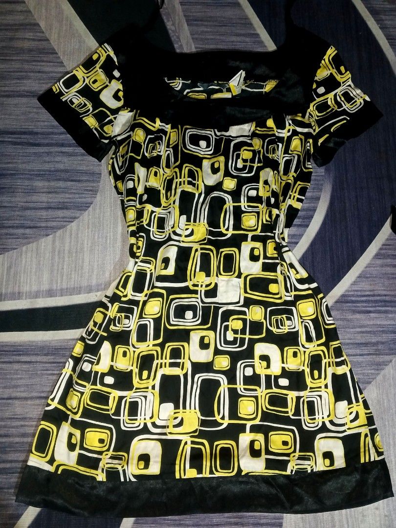 Max studio dress (Category: Announcements) located in Manila. Submitted by icamalicdem29 (Listing ID 1469066501, Image 1). Description: s/m Max Studio graphic mid-century style mini dress featuring a distinctive retro geometric pattern of rounded squares and rectangles in yellow, white, and black. This design showcases a wide, structured square-neck silhouette accented with solid black bands along the neckline, short sleeve cuffs, and bottom heml