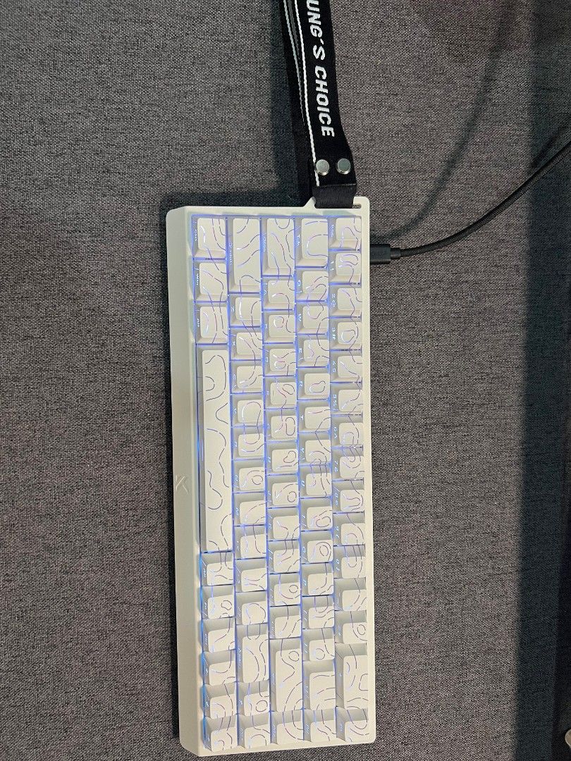 MCHOSE ACE 68 Magnetic Switch Keyboard (Category: Computer Keyboard) located in Manila. Submitted by _frncis (Listing ID 1469136717, Image 1). Description: - Model: MCHOSE ACE 68 magnetic switch keyboard - Color/Design: Clean white with a unique topographic keycap pattern - Features: Compact layout with a stylish left-side carry strap - Gaming Performance: Equipped with rapid trigger switches and customizable actuation - Inclusions: Original box 