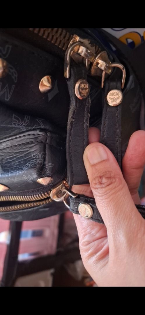 MCM Stark Studded Visetos Backpack Black (Category: Backpacks) located in Cavite. Submitted by chinkee0215020 (Listing ID 1468941176, Image 2). Description: - Authentic MCM backpack in classic black monogram print - Designed with stylish gold metal studs and gold hardware - Practical front zip pocket and roomy interior compartments - Comfortable adjustable straps with woven MCM logo branding - Condition note: Minor wear and edge cracking on the z