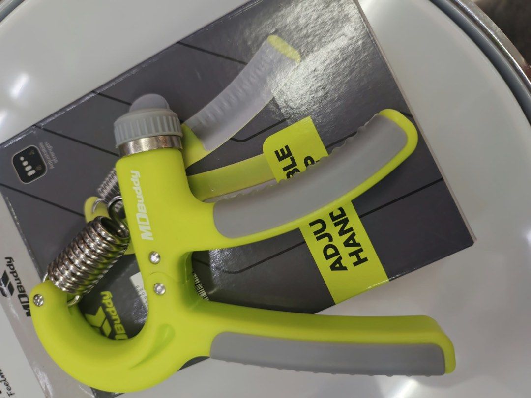 MD Buddy Adjustable Hand Grip Strengthener (Category: Weights & Dumbbells) located in Las Pinas. Submitted by andreadomingo2518 (Listing ID 1469008428, Image 2). Description: - Brand: MD Buddy - Item: Adjustable hand grip strengthener - Color: Lime green and grey - Resistance: Adjustable via twist dial with heavy-duty steel spring - Comfort: Textured rubber handles for a solid, secure grip - Inclusions: Comes with original box - Condition: Excell