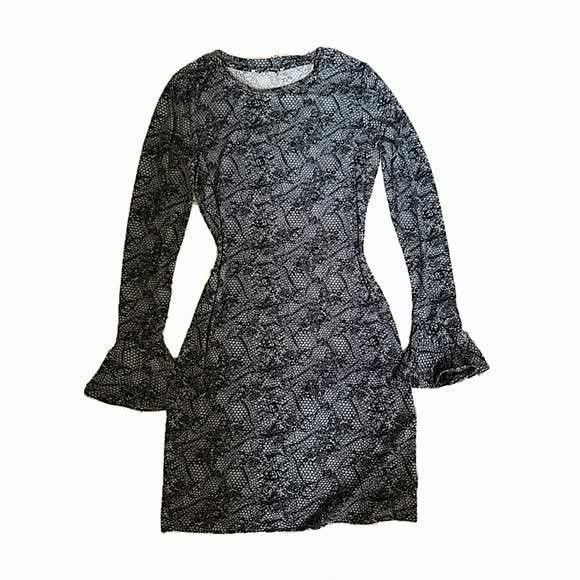 Michael Kors Black and Grey Lace Pattern Dress (Category: Dresses) located in Paranaque City. Submitted by calm_youngstore7 (Listing ID 1469034841, Image 3). Description: 90% OFF RETAIL! - Brand: Michael Kors - Condition: Brand new with original tags in packaging - Color/Pattern: Grey and black pattern - Design: Long sleeves with flared cuffs, round neckline, and fitted silhouette - Length: Above the knee (Total length: 32 inches) - Pit to Pit: 1