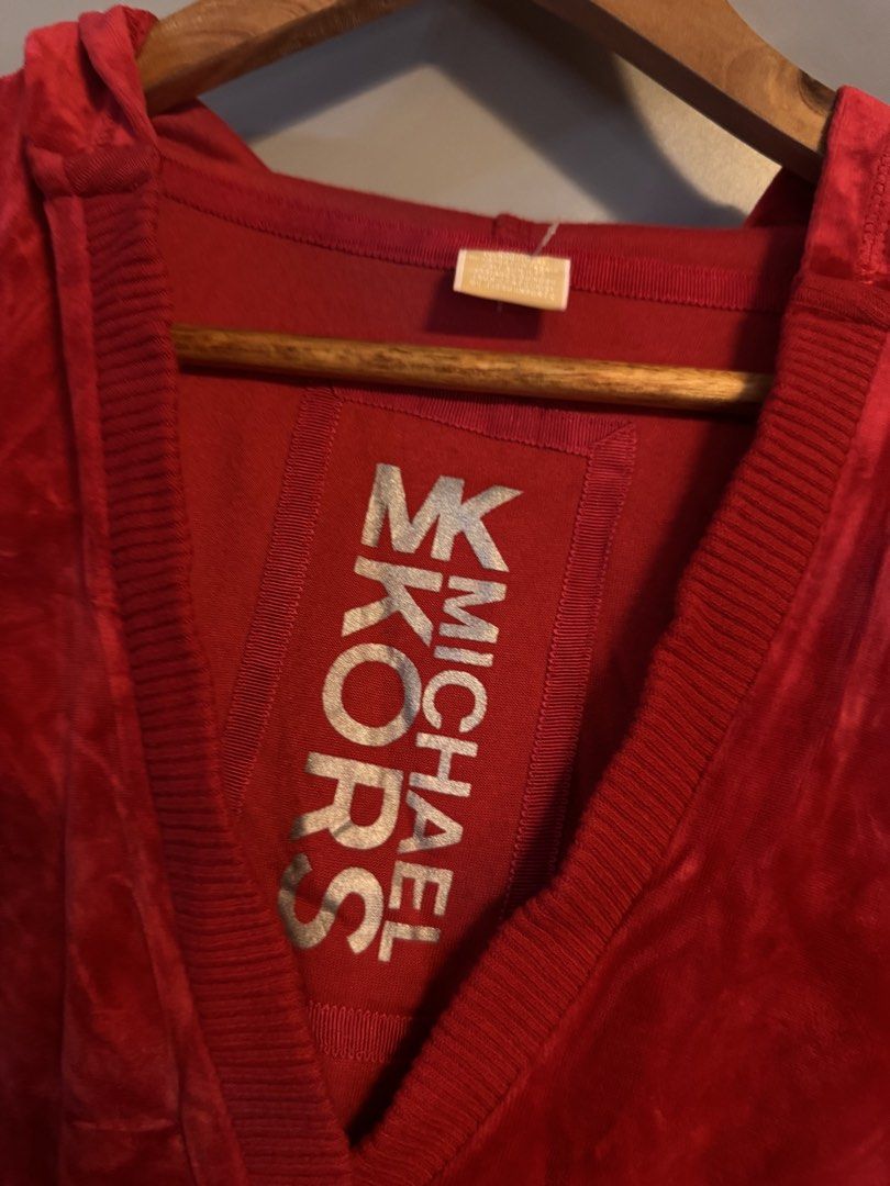Michael Kors Red Velour Hoodie (Category: Coats, Jackets and Outerwear) located in Alaminos. Submitted by outfitcheck.ph (Listing ID 1469103440, Image 2). Description: - Brand: Michael Kors - Item: Red Velour Hoodie - Size: Medium - Material: 74% cotton, 26% polyester - Design: V-neck hood with silver logo patch inside collar - Details: Ribbed cuffs and hem - Condition/Style: Comfortable casual wear.